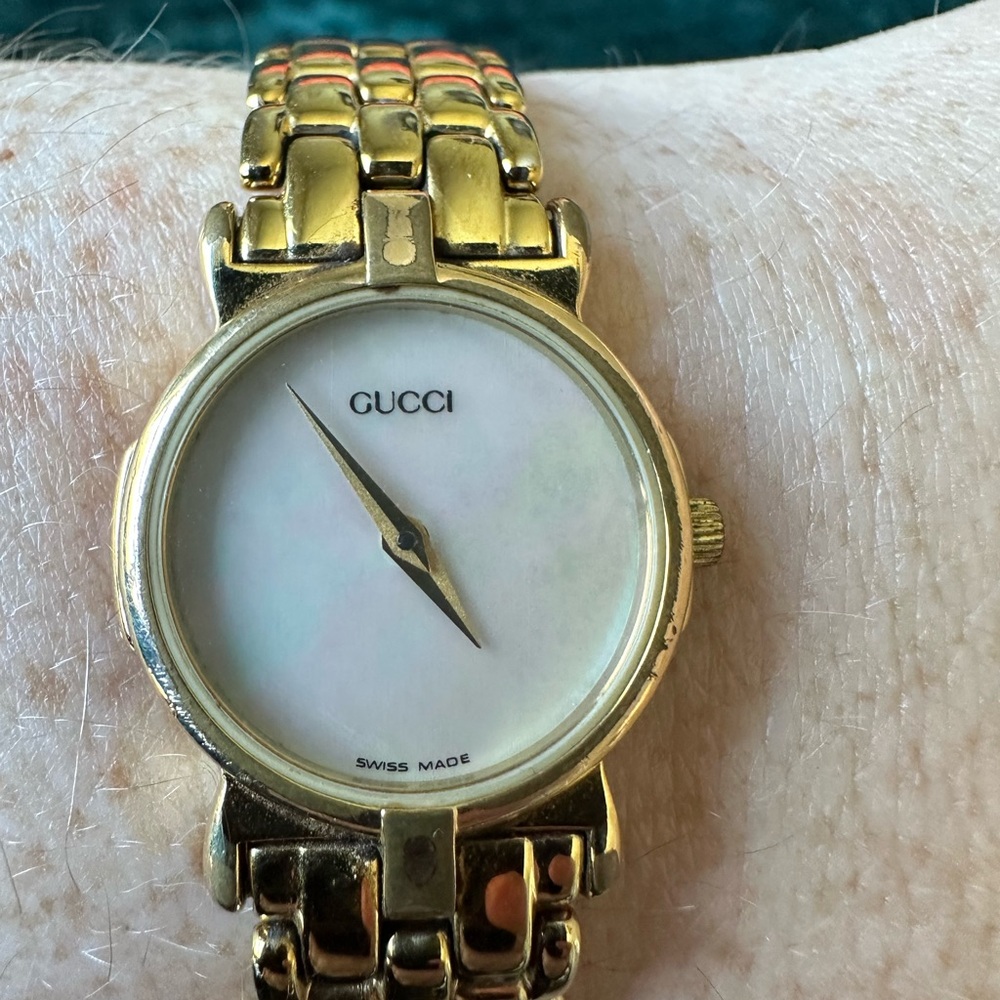 Authentic Gucci Gold-Tone Timepiece with White Mother of Pearl Dial